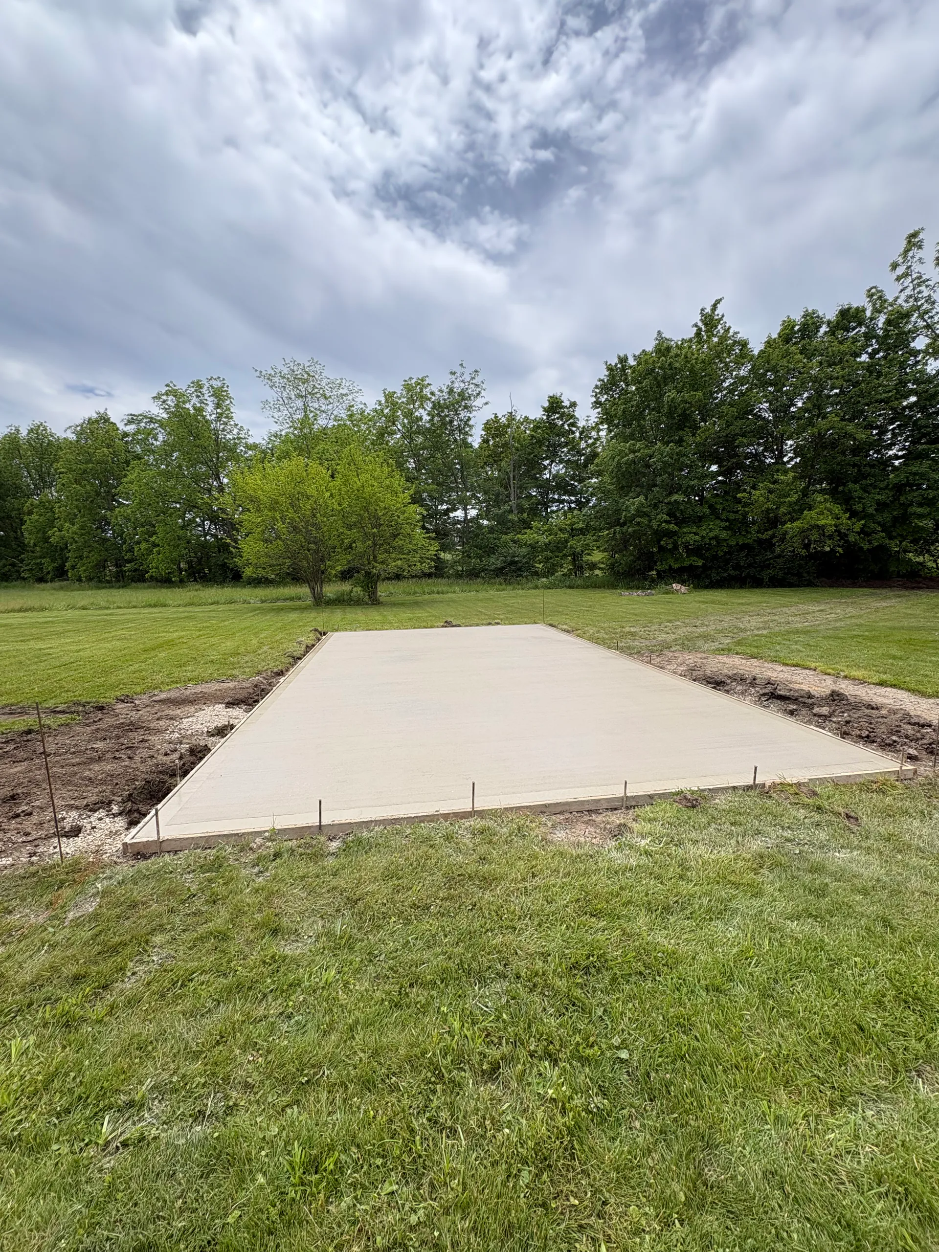 Finished rectangular concrete slab in a residential yard