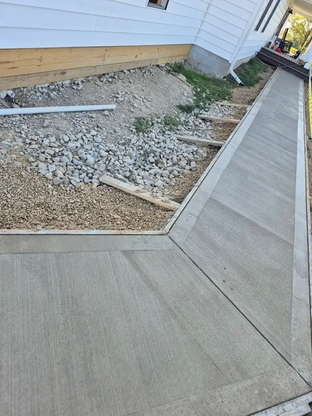 Curved concrete front-entry walkway at a residential home