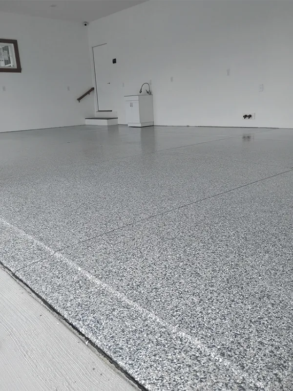 Close view of a finished gray decorative flake garage floor